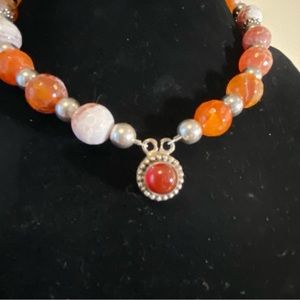 Handmade Fire Agate necklace with pendant and silver spacers.